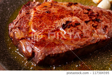 fried steak, beef steak, rib eye steak, in a frying pan, top view, no people 117384395
