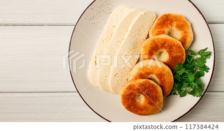 Mchadi, corn tortillas, traditional Georgian dish, corn bread, with Imeretian cheese, homemade, no people, on a light background, Mchadi, corn tortillas, traditional Georgian dish, corn bread, with Imeretian cheese, homemade, no people, on a light background, 117384424