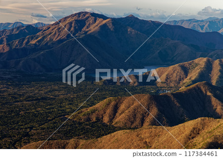 Lake Motosu and the Kenashi mountain ridge seen from Mount Setsugatake in the Misaka Mountains 117384461