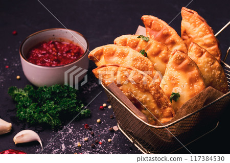 Fried mini pasties, with red sauce, top view, close-up, no people, selective focus, Fried mini pasties, with red sauce, top view, close-up, no people, selective focus, 117384530