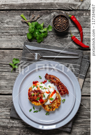 tasty cheese sweet corn pancakes with fried bacon 117384667