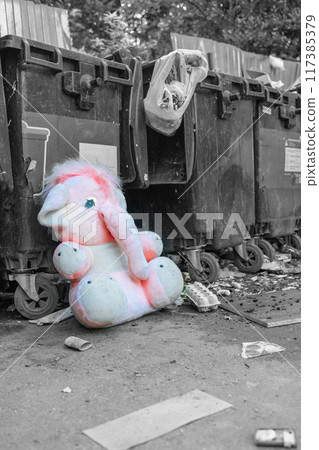 abandoned plush toy. toy pink elephant. discarded dumpster toy. landfill. abandoned plush toy. toy pink elephant. discarded dumpster toy. landfill. 117385379