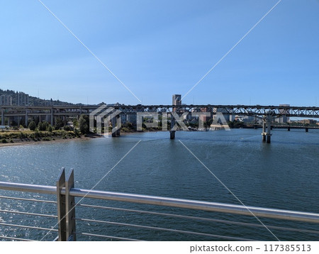 Portland, Oregon, USA - 07.11.2024 View from the Ross Island Bridge to the Marquam Bridge and the city. Portland, Oregon, USA - 07.11.2024 View from the Ross Island Bridge to the Marquam Bridge and the city. 117385513