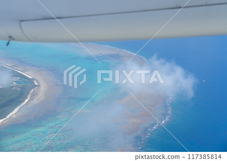 Aerial view of the remote island scenery from an airplane departing from Ishigaki Airport Aerial view of the remote island scenery from an airplane departing from Ishigaki Airport 117385814