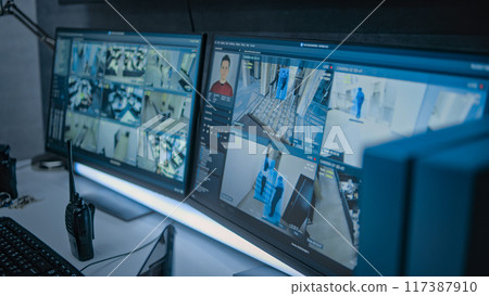 Surveillance footage from CCTV cameras displayed on computer monitors 117387910
