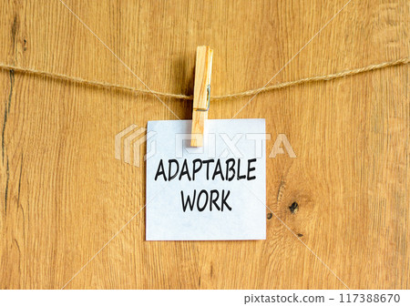 Adaptable work symbol. Concept words Adaptable work on beautiful white paper on wooden clothespin. Beautiful wooden background. Business Adaptable work concept. Copy space. 117388670