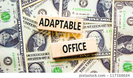Adaptable office symbol. Concept words Adaptable office on beautiful wooden block. Beautiful dollar bills background. Dollar bills. Business Adaptable office concept. Copy space. 117388684