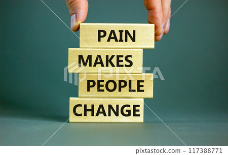 Pain makes people change symbol. Concept words Pain makes people change on wooden blocks on a beautiful grey table grey background. Business, motivational and pain makes people change concept. 117388771