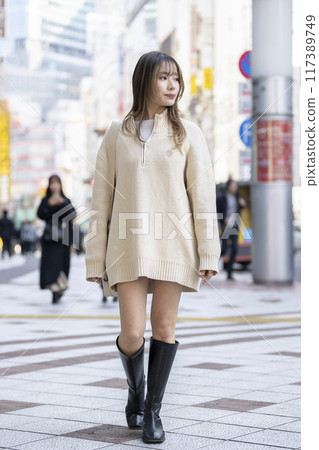 Women in their twenties walking in the city Women in their twenties walking in the city 117389749