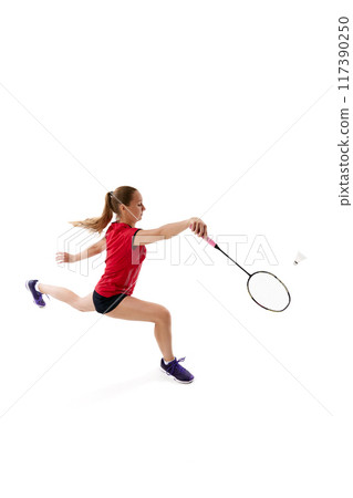 Professional badminton player hitting shuttlecock, during training session before competition against white background. Professional badminton player hitting shuttlecock, during training session before competition against white background. 117390250