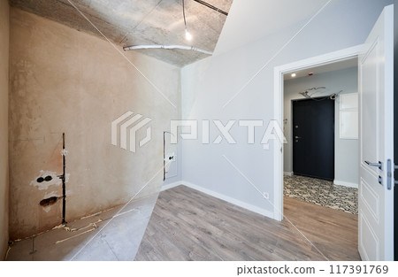 Photo collage of apartment room before and after restoration or refurbishment. Old room with doorway and new renovated living room with parquet floor and elegant interior design. 117391769