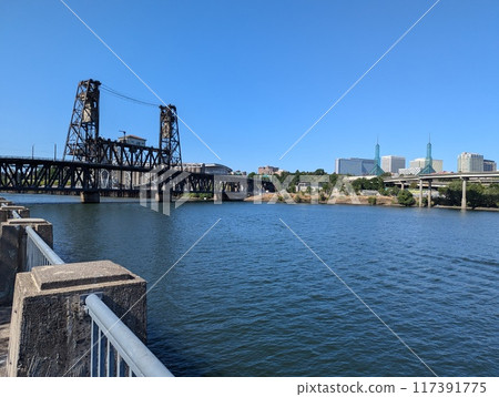 View of the Steel Bridge across the Willamette River. Portland, Oregon, USA View of the Steel Bridge across the Willamette River. Portland, Oregon, USA 117391775