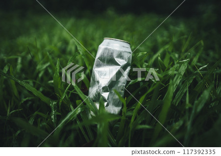 Recycle concept, plastic water bottles on the lawn Recycle concept, plastic water bottles on the lawn 117392335