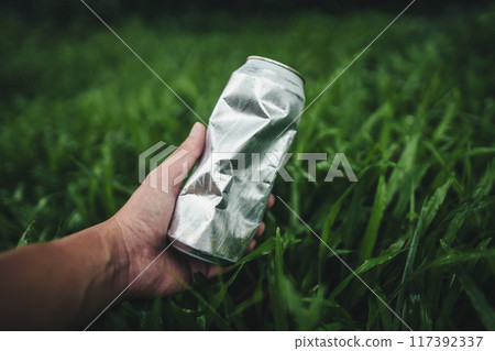 Recycle concept, plastic water bottles on the lawn 117392337