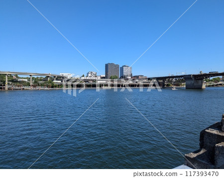 Portland, Oregon, USA - 07.10.2024: View of the Morrison Bridge across the Willamette River. Portland, Oregon, USA. Portland, Oregon, USA - 07.10.2024: View of the Morrison Bridge across the Willamette River. Portland, Oregon, USA. 117393470