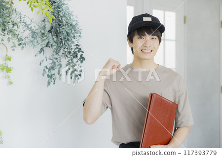 A young male cafe attendant A young male cafe attendant 117393779