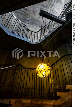 Modern concrete spiral staircase and glass lamp 117393792