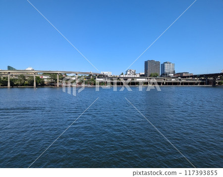 Portland, Oregon, USA - 07.10.2024: View of Portland and the city's transportation hubs across the Willamette River. 117393855