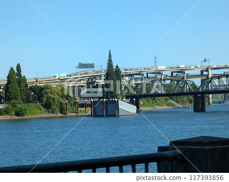 Portland, Oregon, USA - 07.10.2024: View of Portland and the city's transportation hubs across the Willamette River. 117393856