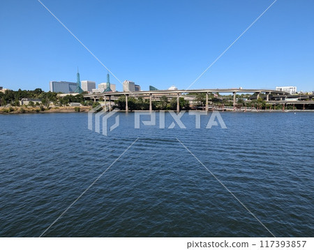 Portland, Oregon, USA - 07.10.2024: View of Portland and the city's transportation hubs across the Willamette River. 117393857