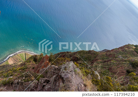 View of the ocean and coastline from the glass-floored Cabo Girao lookout on Madeira Island View of the ocean and coastline from the glass-floored Cabo Girao lookout on Madeira Island 117394210