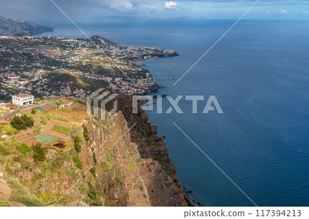 View of the ocean and coastline from the glass-floored Cabo Girao lookout on Madeira Island View of the ocean and coastline from the glass-floored Cabo Girao lookout on Madeira Island 117394213
