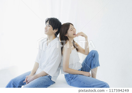 A couple wearing matching denim outfits 117394249