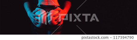 male hands hold a sexy ass of woman girl in panties. Sex between a couple. A wide banner with a black background and a copy space 117394790