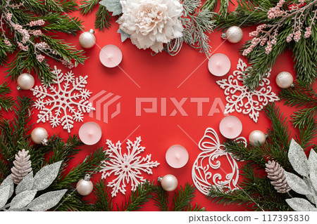 Red Christmas background with fir branches 117395830