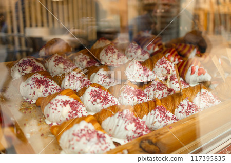 French breakfast. Close up of tray of freshly baked pastries, flavorful, warm, crispy gourmet croissants with powdered sugar, berry and cream. Bakery recipes. Concept of food, bakery, cuisine French breakfast. Close up of tray of freshly baked pastries, flavorful, warm, crispy gourmet croissants with powdered sugar, berry and cream. Bakery recipes. Concept of food, bakery, cuisine 117395835