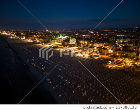 Drone view of the night city and the coast of Rimini, Italy 117396138