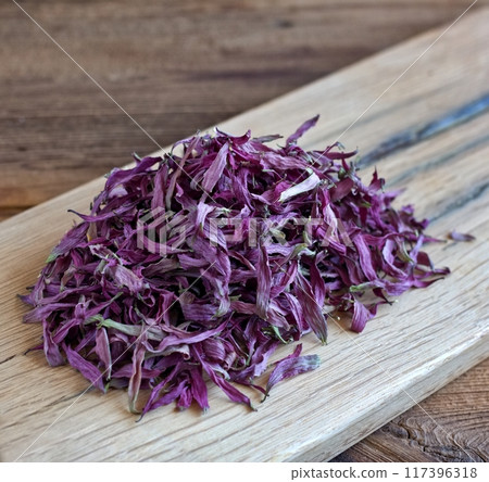 Dried flower petals of Echinacea purpurea, also known as purple coneflower, hedgehog coneflower or echinacea. Dried flower petals of Echinacea purpurea, also known as purple coneflower, hedgehog coneflower or echinacea. 117396318