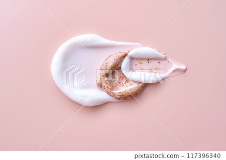 Cream and cream scrub on a pink background. Texture. 117396340