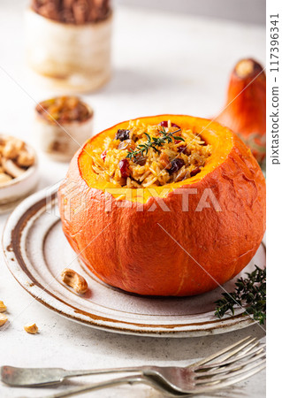 Pumpkin stuffed with rice 117396341