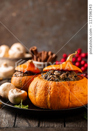 Tasty autumn stuffed pumpkin Tasty autumn stuffed pumpkin 117396343