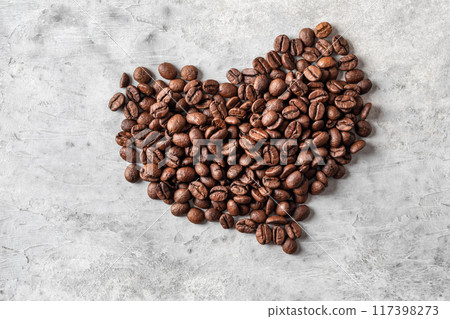 Heart shape coffee beans on gray background Heart shape coffee beans on gray background 117398273
