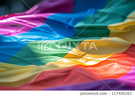 Close-up of a colorful LGBT pride flag waving in the wind, symbolizing diversity and inclusion. 117400263