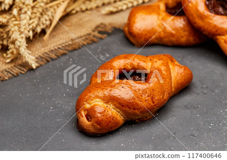 Golden-brown pastries filled with fruit jam, perfect for a delicious breakfast or sweet snack 117400646