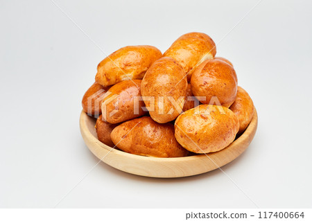 Golden-brown homemade pastries with a glossy crust, perfect for breakfast or a sweet snack Golden-brown homemade pastries with a glossy crust, perfect for breakfast or a sweet snack 117400664