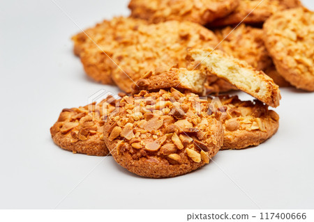 Crunchy peanut cookies with a delicious nutty topping, perfect for a sweet and satisfying snack Crunchy peanut cookies with a delicious nutty topping, perfect for a sweet and satisfying snack 117400666