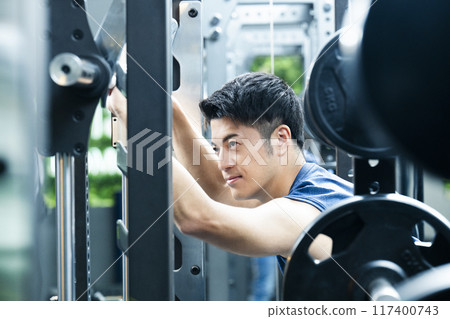 Sports gym, training gym, male, muscle training, portrait 117400743