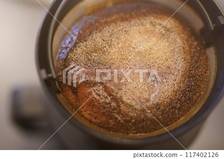 Aerial view of hand-dripped dark roast coffee Aerial view of hand-dripped dark roast coffee 117402126