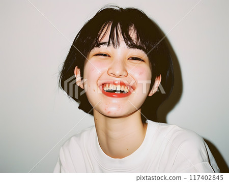 Asian woman with an innocent smile 117402845