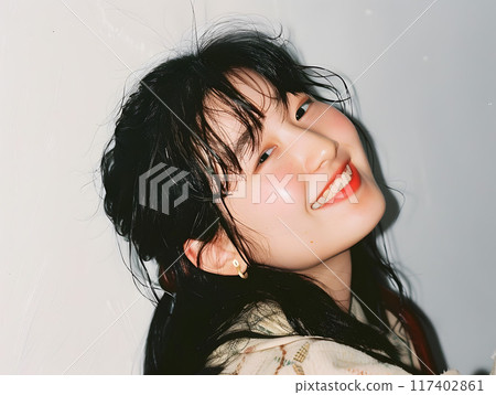 Asian woman with an innocent smile 117402861