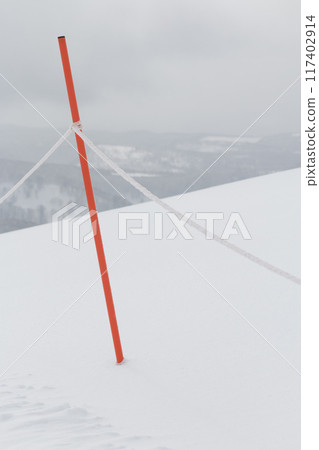 Snowy mountain field seen from the boundary rope of the ski resort 117402914