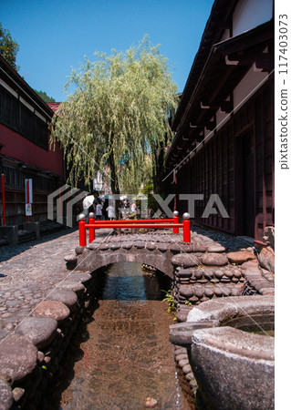 A waterway in the back alleys of Gujo Hachiman 117403073
