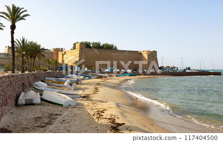 Town of Hammamet in Tunisia. View of ancient fort, coastline and fishing boats Town of Hammamet in Tunisia. View of ancient fort, coastline and fishing boats 117404500