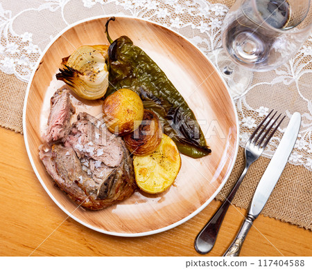 Fried fatty and juicy lamb and vegetable side dish of potato and bell pepper Fried fatty and juicy lamb and vegetable side dish of potato and bell pepper 117404588