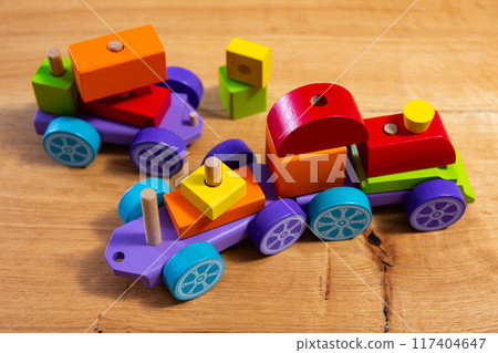 Colorful wooden train toy for preschool aged kids closeup Colorful wooden train toy for preschool aged kids closeup 117404647
