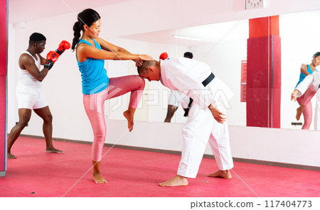 Self-defense lesson for women in gym. Power grabs and strikes Self-defense lesson for women in gym. Power grabs and strikes 117404773